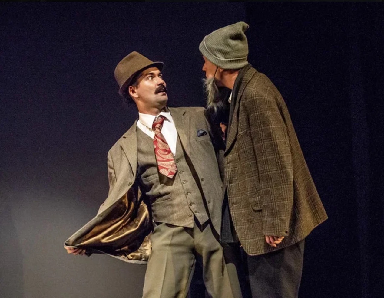 Hannay opens his jacket to a bearded crofter in a knitted hat