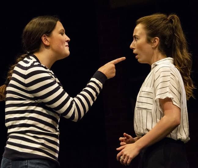 Two young women in a heated confrontation